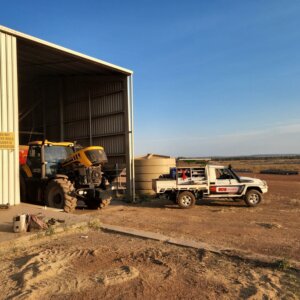 BDS Mechanical Repairs vehicle parked on agriculture dirt with yellow machinery