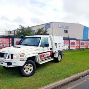 BDS Mechanical Repairs Mackay cruiser parked on green grass in front of the workshop