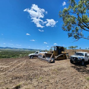 BDS Mechanical Repairs utes and agriculture heavy equipment on a large piece of land with blue skies