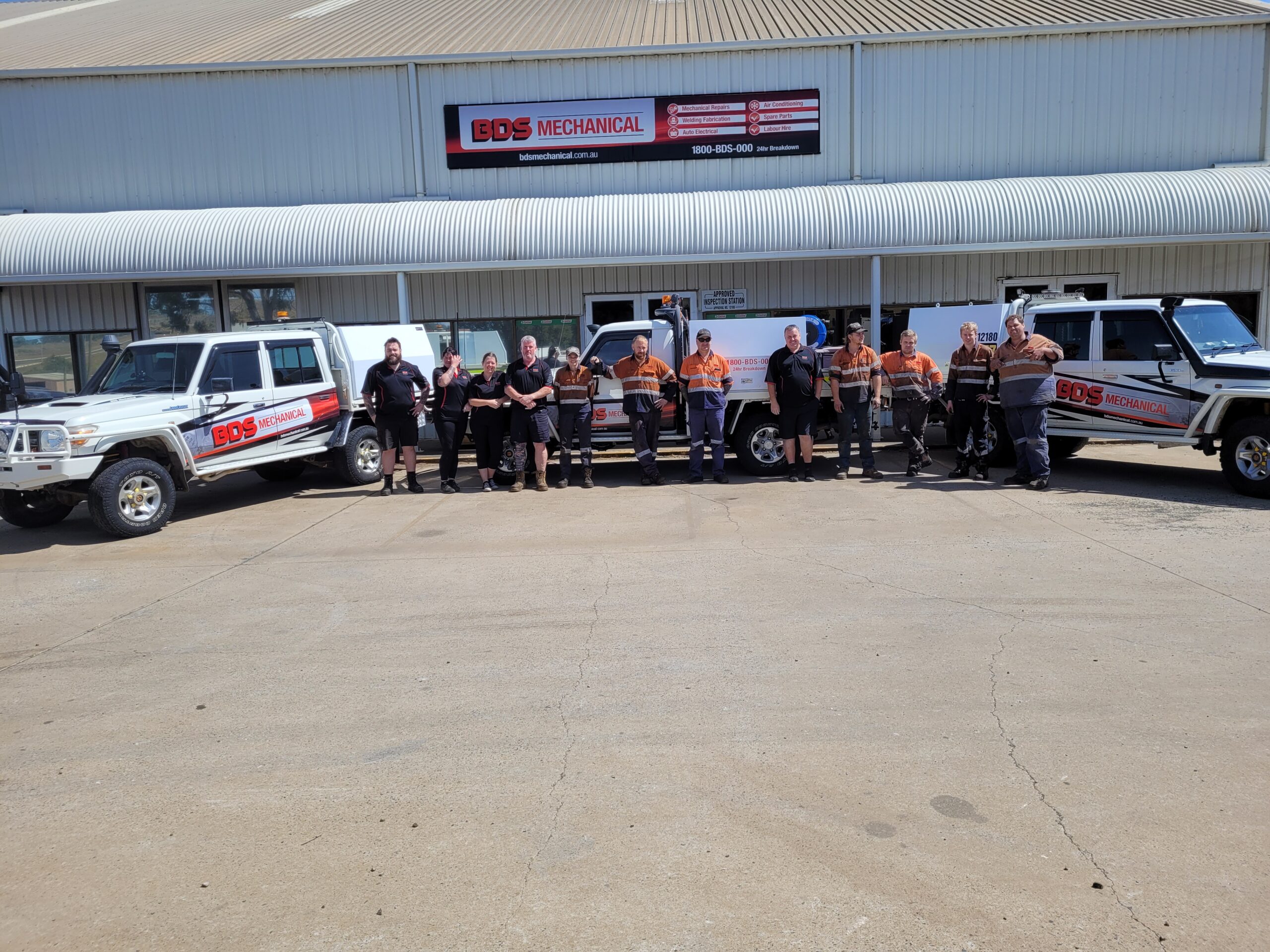 BDS mechanical repairs mechanics standing in front of the bds mechanical repairs toowoomba workshop