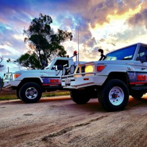 2 BDS Mechanical Repairs utes parked on the road with a blue and yellow sky