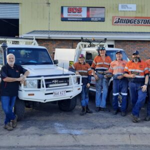 BDS Mechanical Repairs mechanics standing in front of the workshop with utes behind them