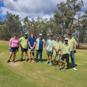 BDS Mechanical Repairs Middlemount at the @AG Middlemount Charity Golf Day 2023. People standing on a gold course at the flag on the green