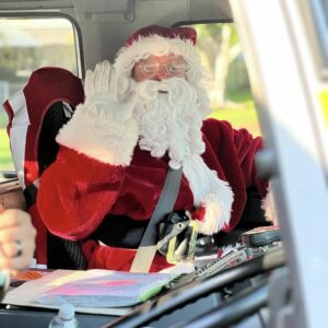 BDS Mechanical Repairs Middlemount sponsoring the Santa Lolly Drop - picture of Santa in the fire truck